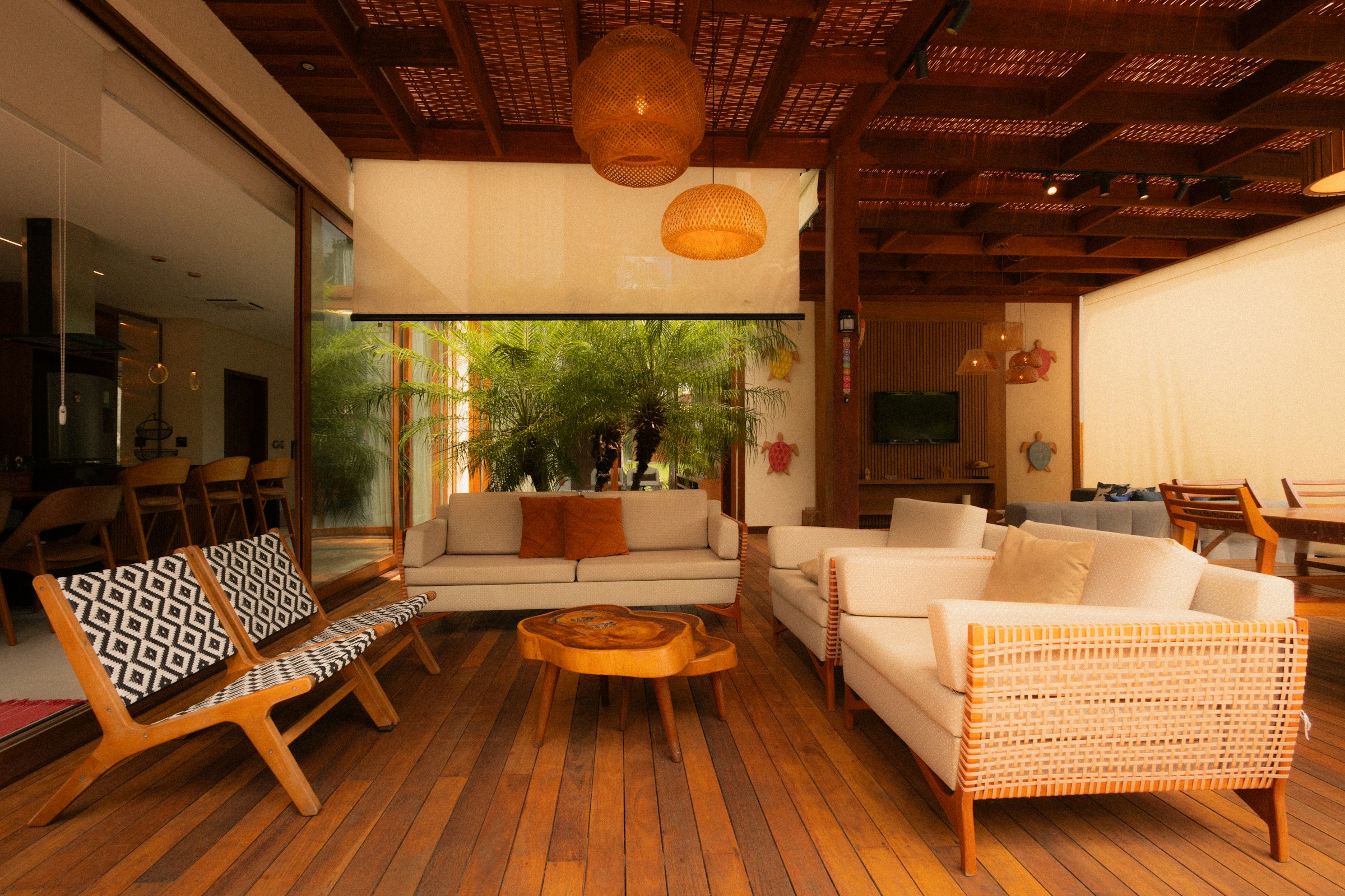 A contemporary living room with natural wood, soft seating and abundant daylight